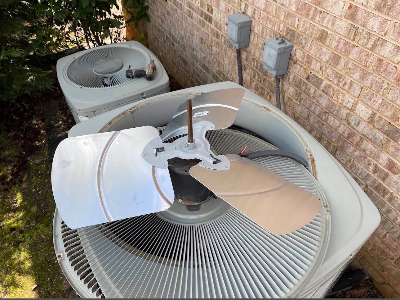 Air conditioning condenser units installed outside a home