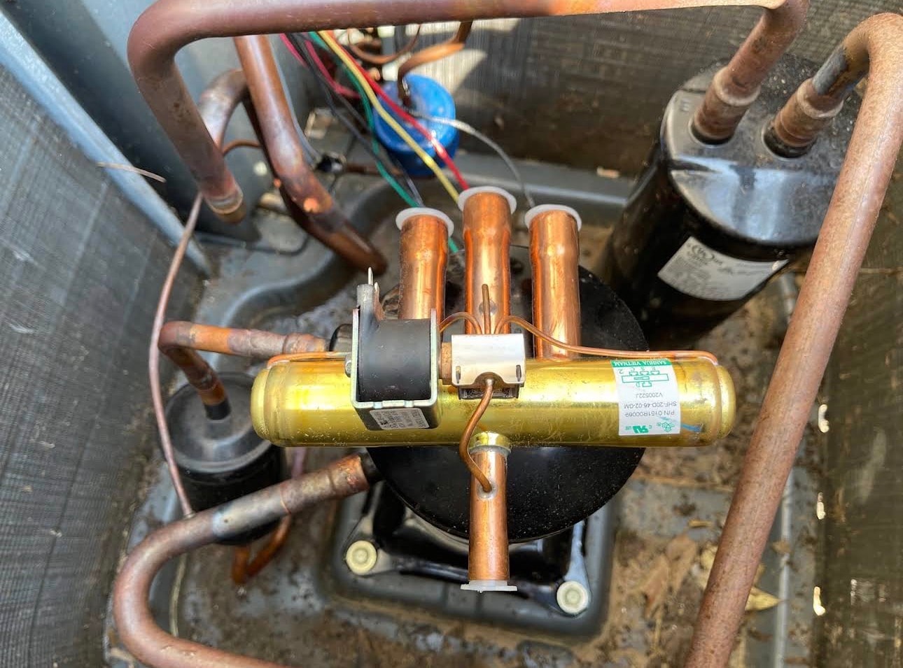 Technician repairing a gas furnace heating system